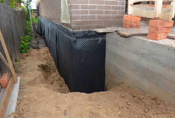 SJ Waterproofing Pros technician performing targeted Interior Drainage System assessment in West Union, OH